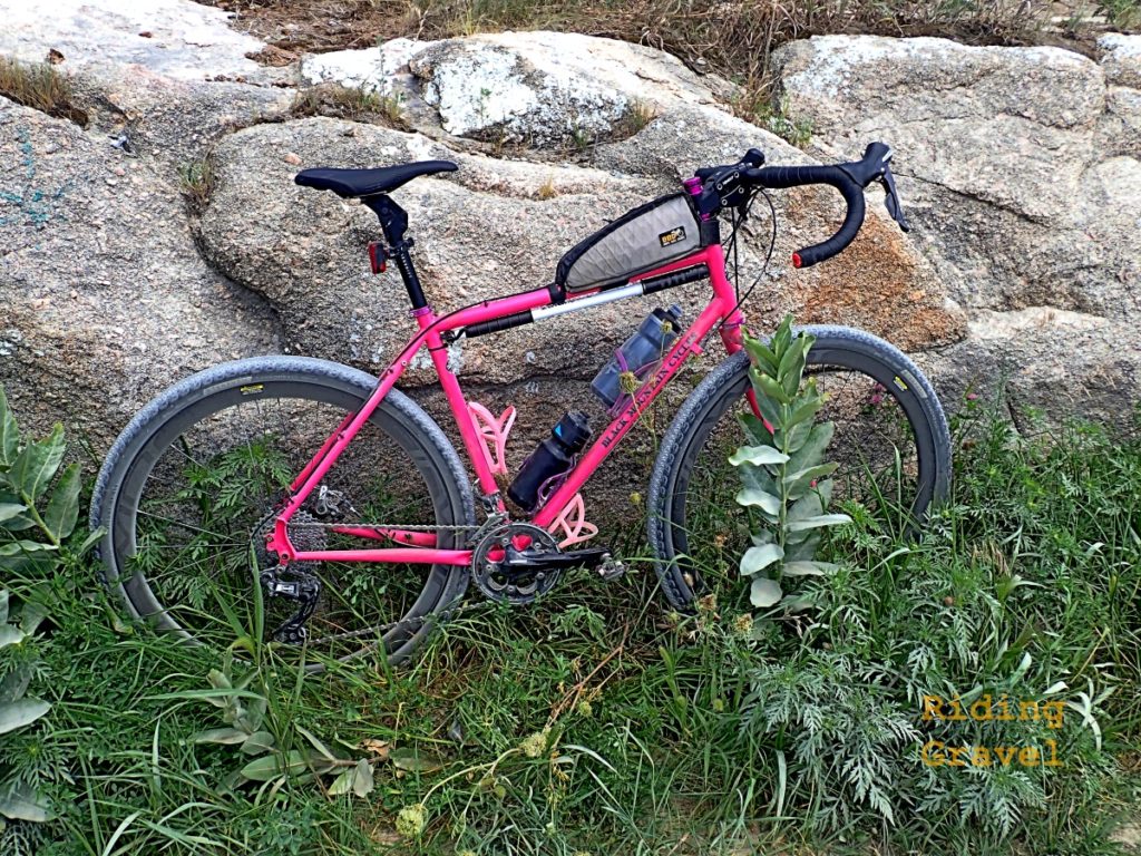 A bike leaning against a boulder