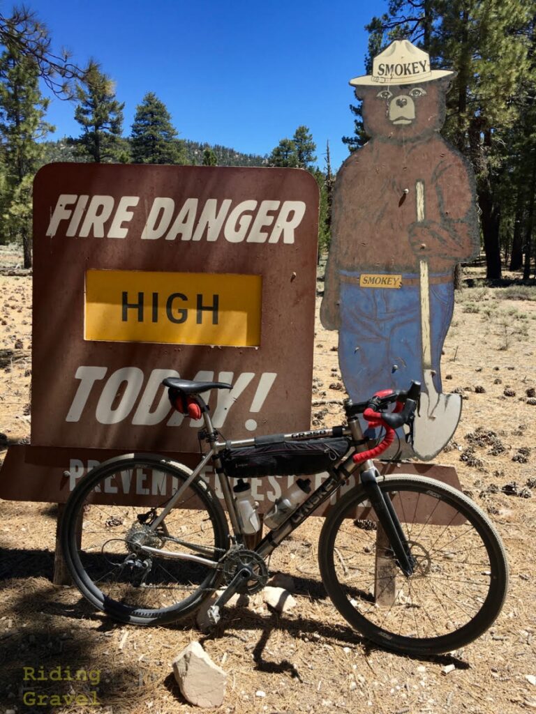 Smoky The Bear sign and a bike.