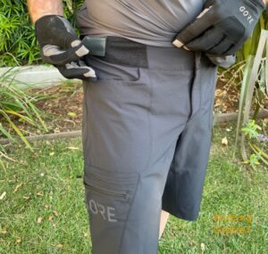 Grannygear demonstrating the waist closure/adjuster on the GORE Passion baggies. 