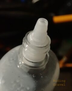 A close up of the nozzle on a bottle of FiberLink Sealant