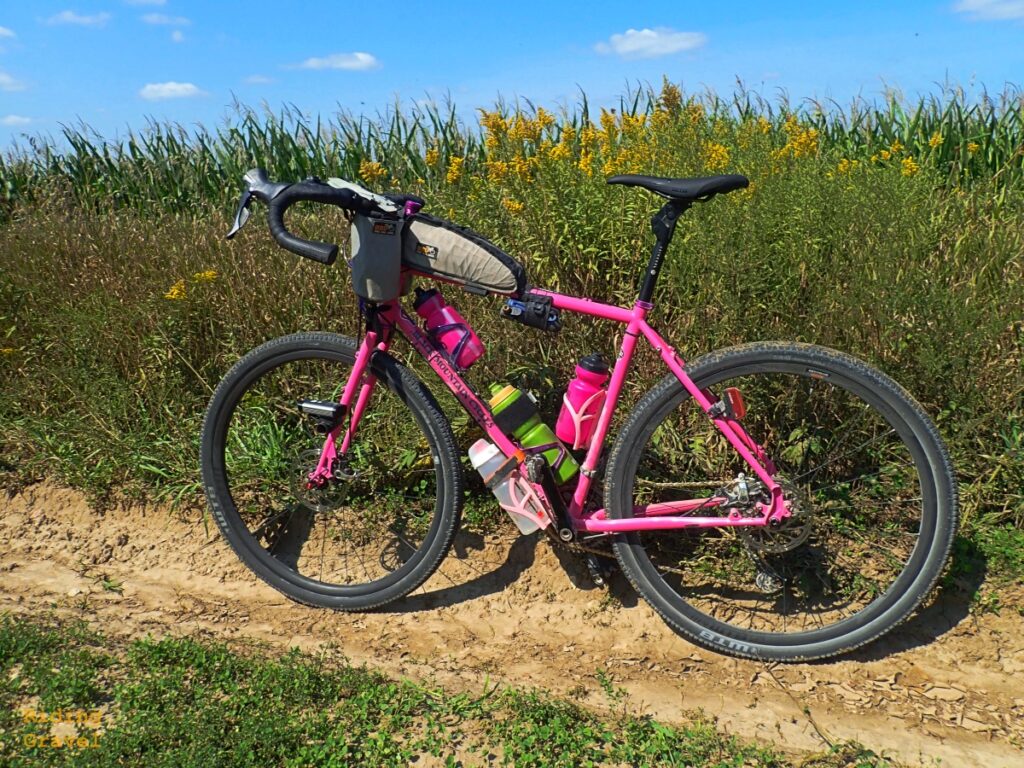 The pink Black Mountain Cycles MCD on a dirt road with the WTB CZR wheels mounted.