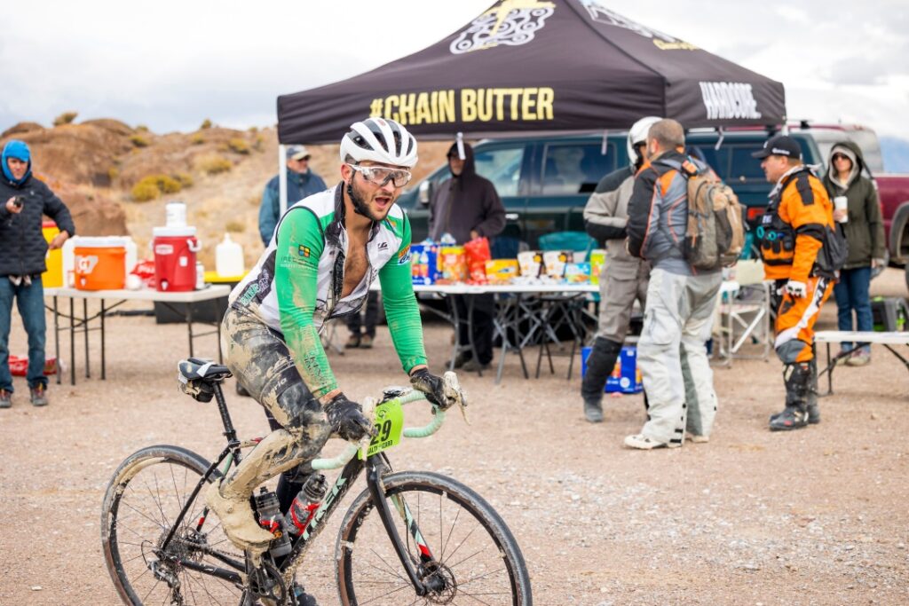 A rider displays a goofy face at the aid station during the Salty Lizard 100