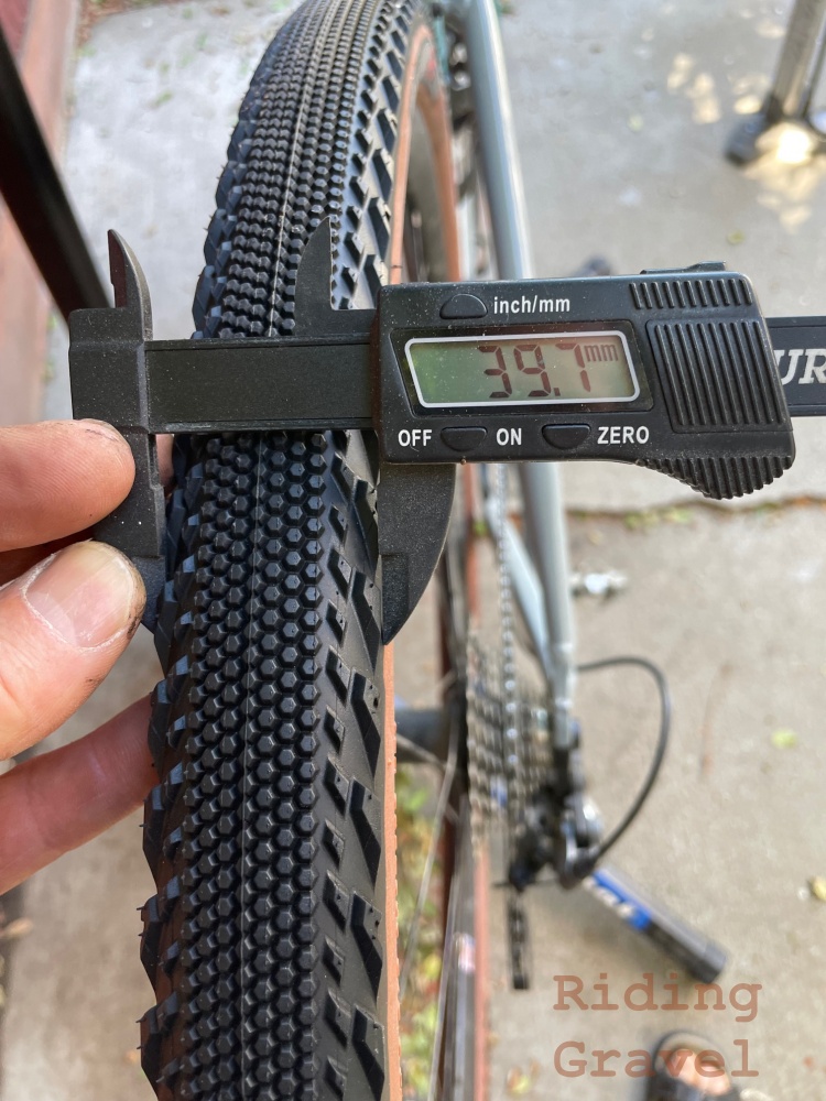 Digital caliper measuring an Alluvium Pro tire.