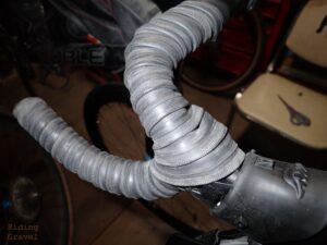 Detail shot showing a rubber innertube wrapped over a handle bar.