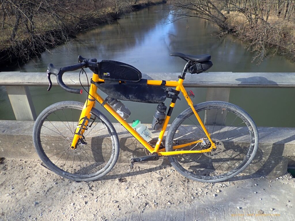 Guitar Ted's Twin Six Standard Rando with WTB Vulpine tires on a bridge over a stream.