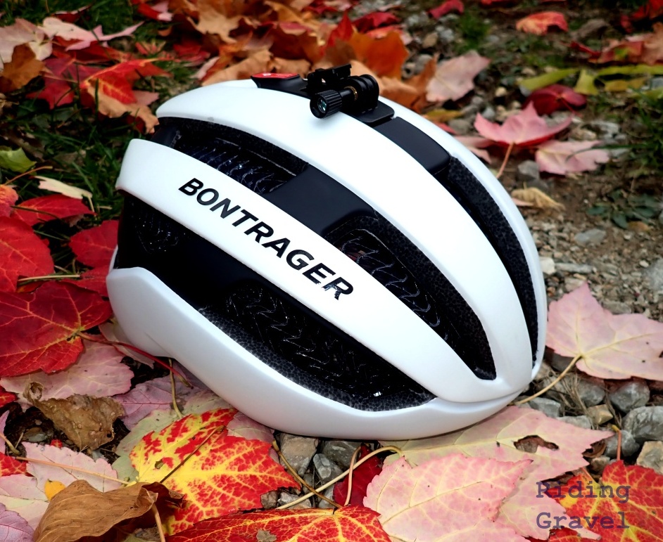 A white Bontrager Circuit WaveCel helmet on some colorful fallen leaves. 