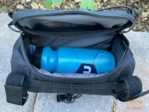 A standard water bottle in the interior of the Astral Handle bar Bag