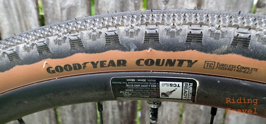 Detail of the hot patch of the Goodyear County tire mounted on a rim. 
