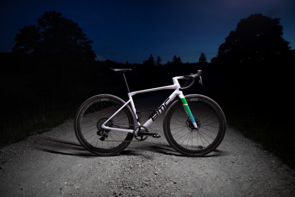 A side view of the BMC Kaius 01 at twilight on a gravel road. 