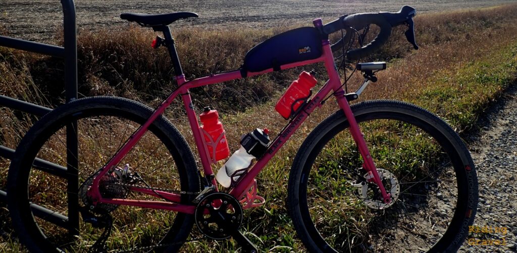 Guitar Ted's bicycle leaning against a gate in a rural area with the Shimano GRX Carbon wheels installed..