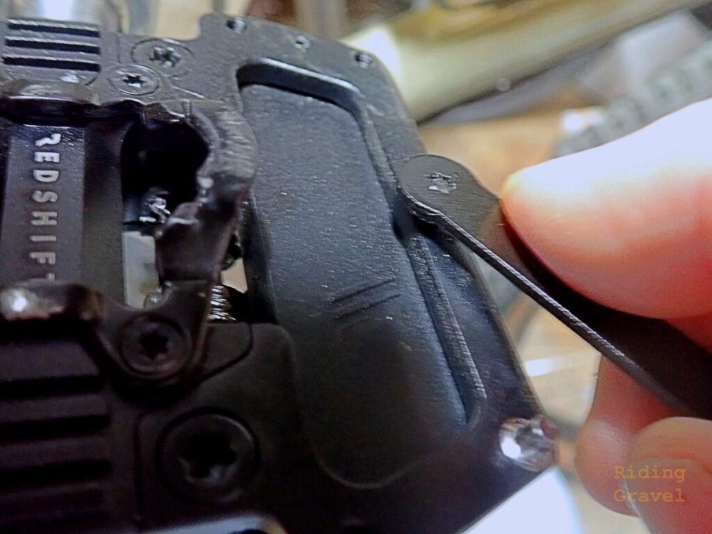 Detail shot showing installation of traction pins on an Arclight Pro pedal. 