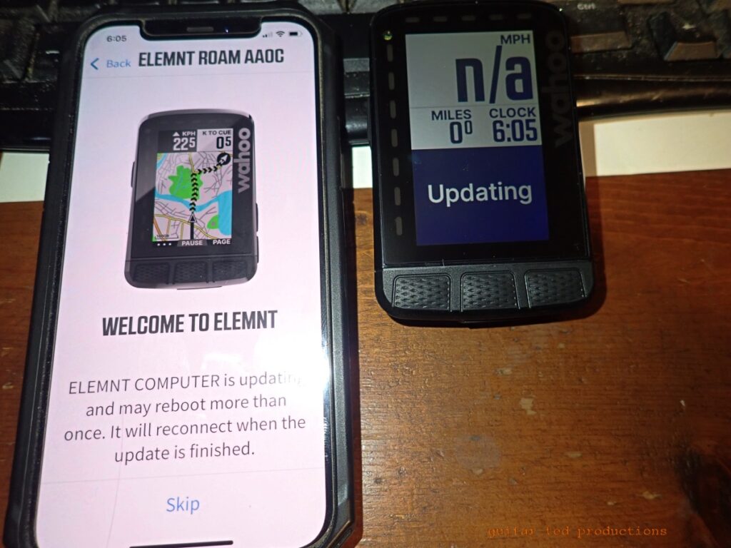Image showing a smart phone and the Elemnt ROAM during set up.