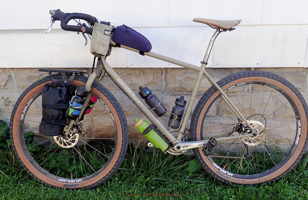 image of a Singular Gryphon Mk3 bicycle against a wall. 