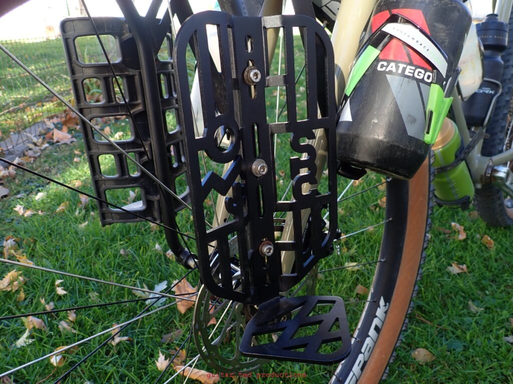 Close up of the State Bicycle Co Cargo Cage mounted on a fork leg. 